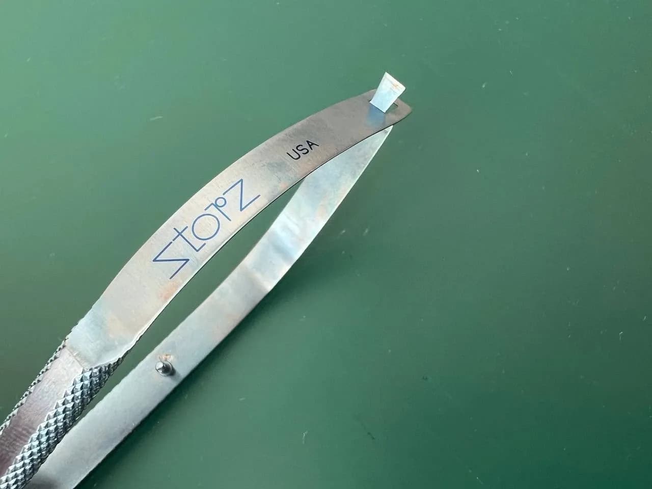 Storz ET2901 Hall lens insertion forceps, 4 1/4'',angled, thin, long jaws